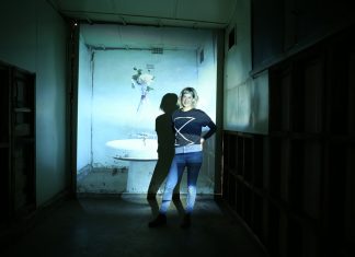 Art in unusual places Georgie Mattingley is pictured with one of her installations at the old Ajax foundry in Kyneton.