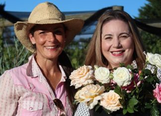 A shared love of flowers and writing Micro rose and peony farmer Danielle White with author Vanessa Carnevale.