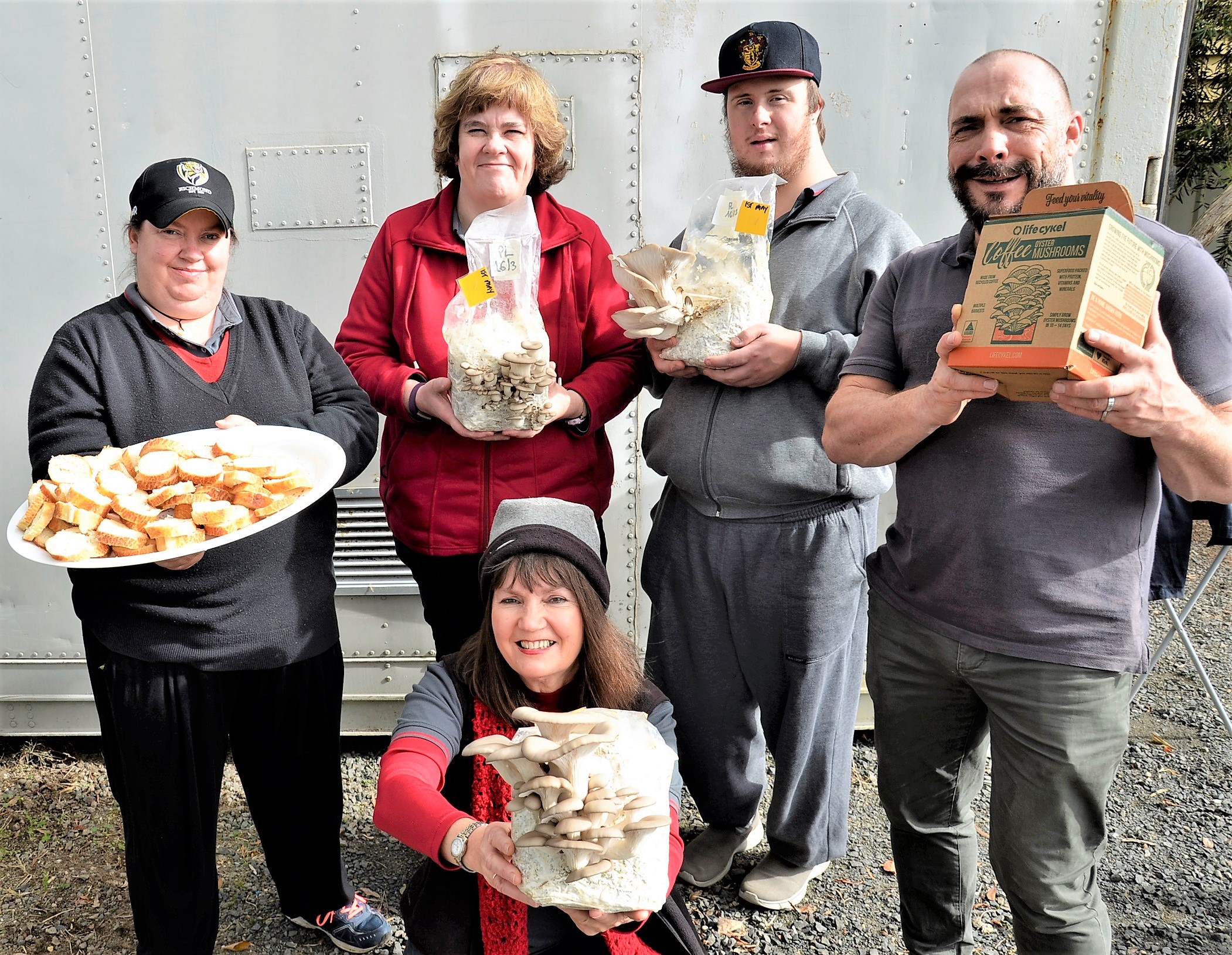 Windarring Urban Mushroom Farm workers Tegwen Prest, Melissa Gale and Josh Dixon with Windarring's employment pathways manager Mark Castle and team leader Mandy Fennessy.