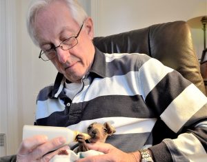 Local wildlife rescuer Ian Slattery with orphaned kangaroo joey Charlie who lost his mother to road trauma.