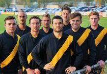 Limited edition … get in quick! KFNC's 2018 senior footballers model the commemorative jumper.