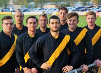 Limited edition … get in quick! KFNC's 2018 senior footballers model the commemorative jumper.