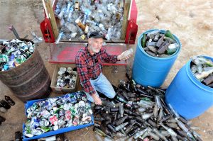 Castlemaine's Bill Wiglesworth - with some of the litter he collected beside the Pyrenees Highway just west of Elphinstone - is lobbying the state government for a container recycling deposit scheme.