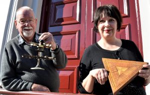 Pioneers and Old Residents Association secretary Wilson Bunton and Castlemaine library officer Donna Steven with some of the curiosities to feature in Chronicles and Curiosities of old Castlemaine.