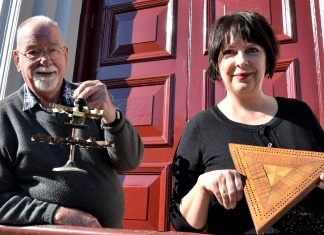 Curiosities of old Castlemaine Pioneers and Old Residents Association secretary Wilson Bunton and Castlemaine library officer Donna Steven with some of the curiosities to feature in Chronicles and Curiosities of old Castlemaine.