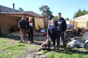 From left: Luke Mills of Next Level Property Maintenance, Erica Gray from Reece Plumbing Sunbury, disability pensioner Nikki Anticevic and David Cannon with David's dog Jazz.