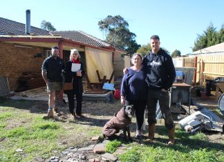Boxer pays it forward From left: Luke Mills of Next Level Property Maintenance, Erica Gray from Reece Plumbing Sunbury, disability pensioner Nikki Anticevic and David Cannon with David's dog Jazz.