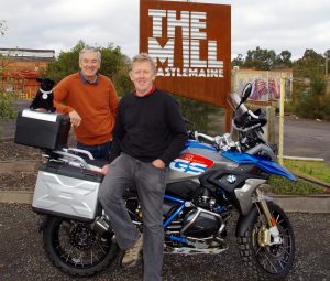 Greg Barkla and Bob Bent with Bob's bike and Winston the Black Dog mascot at The Mill in Castlemaine.