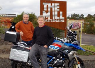 Locals join the ride Greg Barkla and Bob Bent with Bob's bike and Winston the Black Dog mascot at The Mill in Castlemaine.