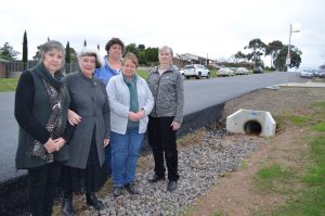 Goldfields Quilters Brenda, Beverley, Glenda, Kathy and Chris are among those concerned about the dangers of the deep guttering outside the Leisterville hall.