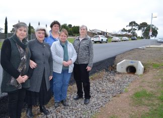 An accident waiting to happen Goldfields Quilters Brenda, Beverley, Glenda, Kathy and Chris are among those concerned about the dangers of the deep guttering outside the Leisterville hall.