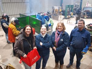 Romsey Neighbourhood House coordinator Michell Balthazar and Bendigo TAFE student Danielle Stanton are pictured with Romsey Engineering representatives, workshop instructor Graham Stanton and some of the first women taking part in the welding workshop.
