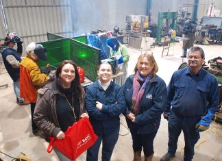 Workshop’s creative spark Romsey Neighbourhood House coordinator Michell Balthazar and Bendigo TAFE student Danielle Stanton are pictured with Romsey Engineering representatives, workshop instructor Graham Stanton and some of the first women taking part in the welding workshop.