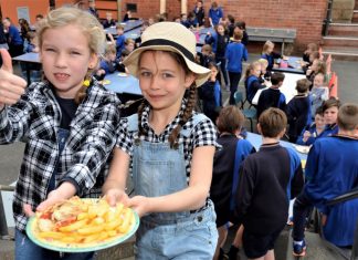 Parma charmer Young Ainsley Nash and Kate Hemphill dressed in farm-themed attire especially for Castlemaine Primary School's Parma for a Farmer lunch on Friday.