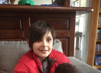 Jarrah’s fight for sight Jarrah with his new prosthetic eyes and his puppy dog.