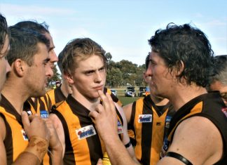 And now for the finals! Woodend-Hesket coach Tom Carland tries to inspire his side against the Bombers.