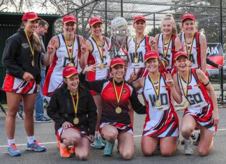 Extra time gives Saints flags Saints A Graders pose with the trophy. Photo: Peter Banko