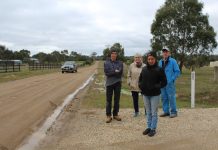 Dust up with council (L to R): Steven Wilson, Jenny Stubbs, Trish Harris and Alan Smith are pictured beside the unsealed section of Batters Lane. In the summer, traffic sends a constant stream of dust across their properties.