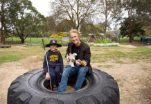 Concert for Jarrah Nine-year-old Jarrah Podesta with John Farnham Band guitarist Brett Garsed. Photo: Dean McLaren