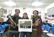 Help blow the trumpet Foundry Band musicians Mark Anstey and Alison Hanley and filmmaker Leonie Van Eyk with a photograph of the local band.