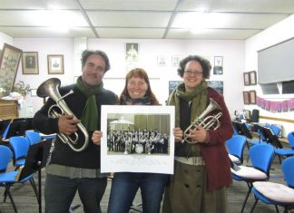 Help blow the trumpet Foundry Band musicians Mark Anstey and Alison Hanley and filmmaker Leonie Van Eyk with a photograph of the local band.