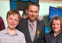 Devotion to duty Newstead publican Trevor Mitchell is pictured with his Conspicuous Service Cross and his children Tom and Claire at Government House on September 5.