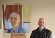 Local finalist Castlemaine artist Mark Dober is pictured with his self-portrait.