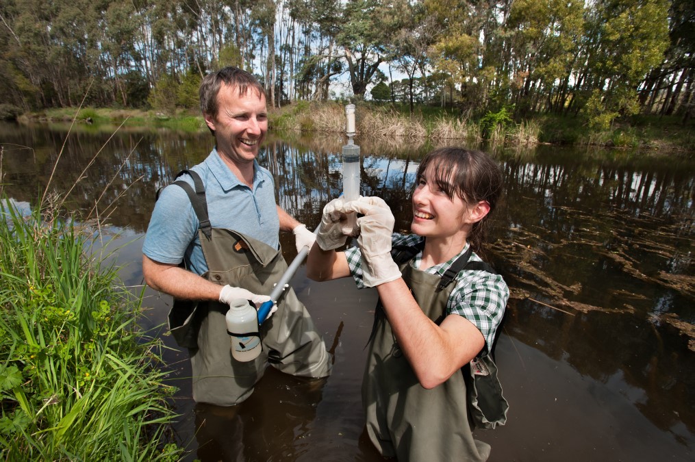 Twelve-year-old Lana Hughes, a year seven student from Kyneton Secondary College, takes one of the first water samples from the Campaspe River with platypus expert Josh Griffiths from EnviroDNA. Photo: Sandy Scheltema