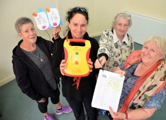 Push for defib Community health nurse Bronwyn Grieve (holding a defibrillator) with CDCH volunteers Kaye Bourke, Joan White and Lyn Hall are supporting the petition for a public after-hours defibrillator.