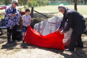 Mayor Bronwen Machin, youngster Mitchell Stephens and Castlemaine RSL president John Whiddon unveil the memorial plaque in honour of Mitchell's great-great-great uncle Walter Peeler VC. Photo: Max Lesser