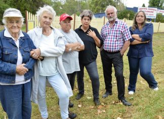 Billboard blow – VCAT overturns council refusal Local residents are pictured at the site of the proposed billboard earlier this year. Photo: Eve Lamb