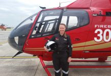 Our fire bird Amy Miller pictured with a Firebird 306 at Microflite headquarters at Moorabbin Airport.