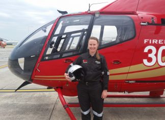 Our fire bird Amy Miller pictured with a Firebird 306 at Microflite headquarters at Moorabbin Airport.