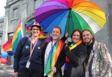 Rainbow flag to fly Mez Lanigan, Chloe McKenzie, Jenny Cowan and guest speaker Nevo Zisin at a past local IDAHOBIT celebration.