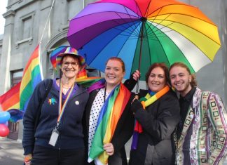 Rainbow flag to fly Mez Lanigan, Chloe McKenzie, Jenny Cowan and guest speaker Nevo Zisin at a past local IDAHOBIT celebration.
