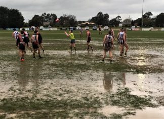 Top teams tumble in flooding footy