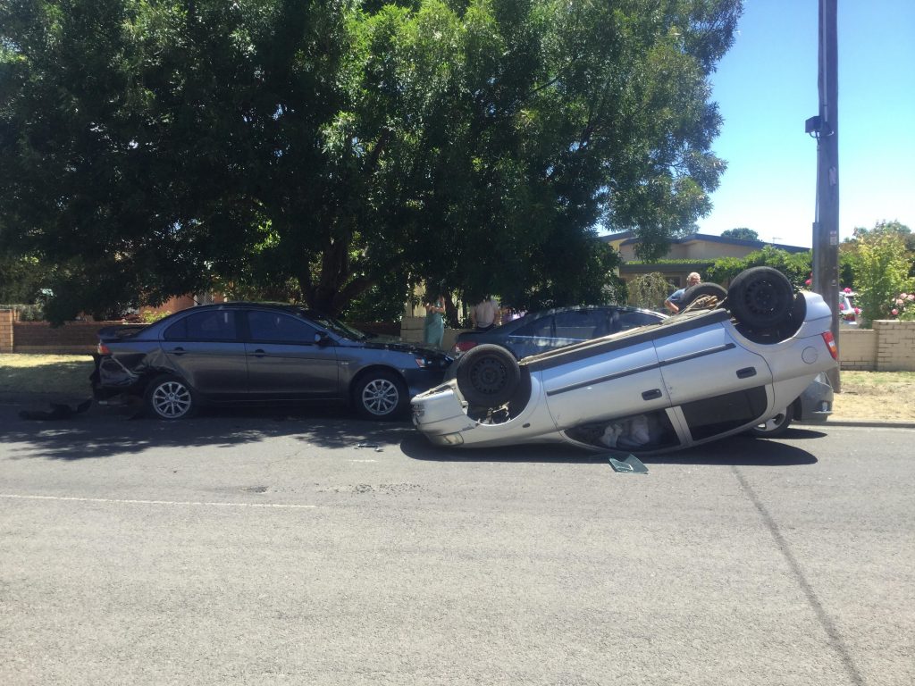 Car flips in Kyneton crash, driver flees scene