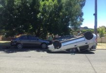 Car flips in Kyneton crash, driver flees scene
