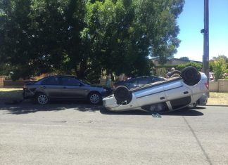 Car flips in Kyneton crash, driver flees scene