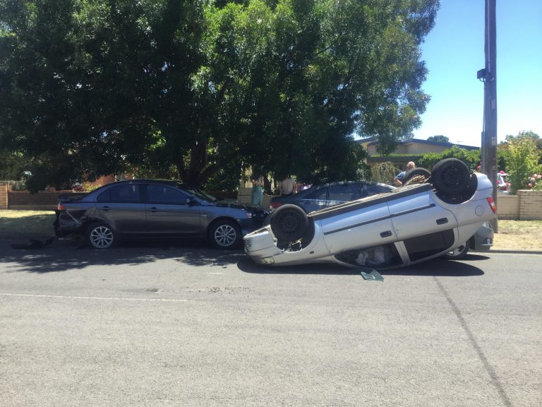 Car flips in Kyneton crash, driver flees scene