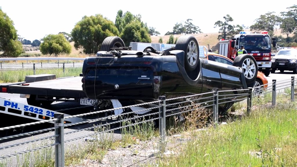 Trailer jack-knifes, ute rolls on Calder