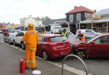 Car hits parked vehicles
