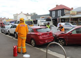 Car hits parked vehicles