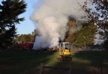 Builders try to burn a house