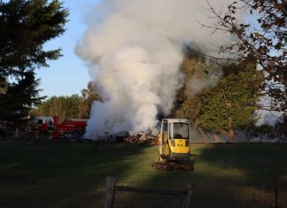 Builders try to burn a house
