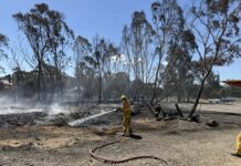 Emergency services continue fire fight